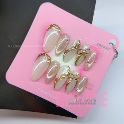 Press on Nails | Pearlescent Nude Cat Eye with Gold Swirl & Pearl Bow Accents, Daily Nail Style, Stiletto Shape, Medium Length Luxury Handmade Fake Nails