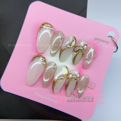 Press on Nails | Pearlescent Nude Cat Eye with Gold Swirl & Pearl Bow Accents, Daily Nail Style, Stiletto Shape, Medium Length Luxury Handmade Fake Nails