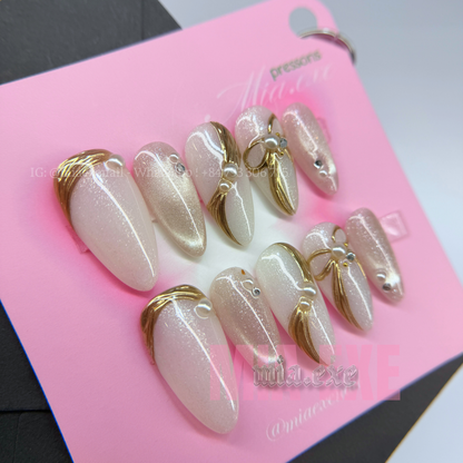 Press on Nails | Pearlescent Nude Cat Eye with Gold Swirl & Pearl Bow Accents, Daily Nail Style, Stiletto Shape, Medium Length Luxury Handmade Fake Nails