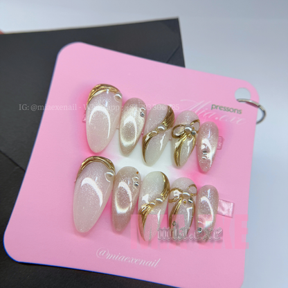 Press on Nails | Pearlescent Nude Cat Eye with Gold Swirl & Pearl Bow Accents, Daily Nail Style, Stiletto Shape, Medium Length Luxury Handmade Fake Nails