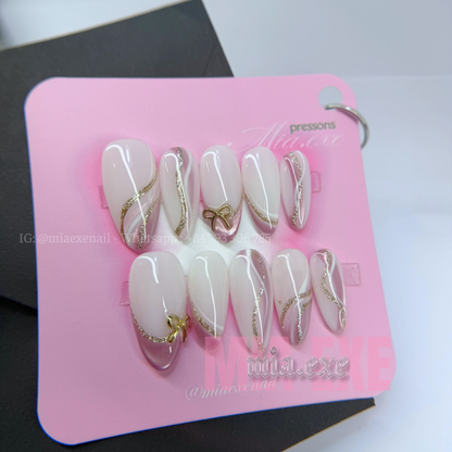 Press on Nails | Nude & Gold Glitter Swirl with Bow Charm, Daily Nail Style, Almond Shape, Medium Length Luxury Handmade Fake Nails