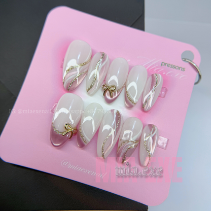 Press on Nails | Nude & Gold Glitter Swirl with Bow Charm, Daily Nail Style, Almond Shape, Medium Length Luxury Handmade Fake Nails