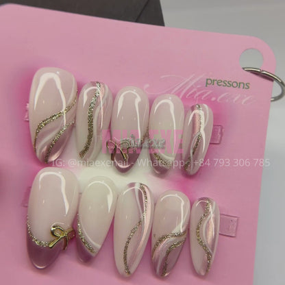 Press on Nails | Nude & Gold Glitter Swirl with Bow Charm, Daily Nail Style, Almond Shape, Medium Length Luxury Handmade Fake Nails